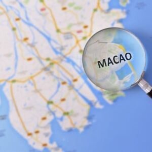 Map,Of,Macao,Consulted,With,A,Magnifying,Glass,Highlighting,The